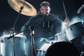 Drummer rehearsing on drums before rock concert. Man recording music on drum set in studio Royalty Free Stock Photo