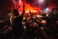 Drummer on stage. silhouette of music band in action on music stage. popular music rock band performs on stage