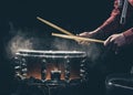 The drummer& x27;s hands hold drumsticks and play the snare drum. Royalty Free Stock Photo