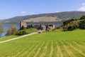 Urquhart Castle ruins on Loch Ness shore, embraced by Scottish Highlands Royalty Free Stock Photo