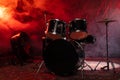Drums and drum set. Beautiful blue and red background, with rays of light. Beautiful special effects of smoke and lighting. Royalty Free Stock Photo