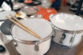 Drums and drumsticks on showcase in music store