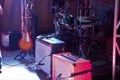 Drums, guitar and amps back line at gig on stage