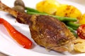 Drumstick of baked Goose with green beans,potatoes