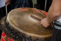 Drumsticks beating on a Chinese traditional drum. Royalty Free Stock Photo