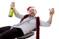 Drunk businessman drinking champagne wearing santa