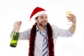 Drunk businessman drinking champagne wearing santa hat isolated white background Royalty Free Stock Photo