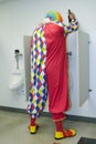 Drunk Clown in Urinal Royalty Free Stock Photo