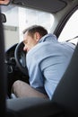 Drunk man slumped on steering wheel Royalty Free Stock Photo