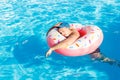 Drunk resting guy on the inflatable circle in the swimming pool of the hotel Royalty Free Stock Photo