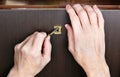 A drunk rustic man tries to open a locked bar with alcoholic drinks