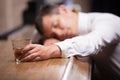 Drunk and unconscious guy lying on counter. Royalty Free Stock Photo