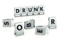 DRUNK word written on glossy blocks and fallen over blurry blocks with SOBER letters. Isolated on white. One of the most Royalty Free Stock Photo