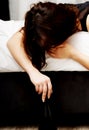 Drunk young woman sleeping on bed. Royalty Free Stock Photo