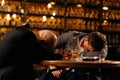 drunken men sleeping on a table in a pub after work. friends, colleagues, drink alcohol Royalty Free Stock Photo