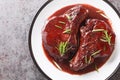 Drunken Pork Chops with red wine sauce and herbs closeup on the plate. Horizontal top view Royalty Free Stock Photo