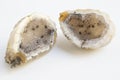 Druse of natural mineral agate. Closeup photo. Couple of beige crystals with black small inclusions. Royalty Free Stock Photo