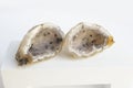 Druse of natural mineral agate. Closeup photo. Couple of beige crystals with black small inclusions. Royalty Free Stock Photo