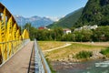 Drusus bridge in Bolzano passing river Talvera with the Dolomites Italian Alps on the background, Italy