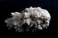 Drusus gypsum. white stone on a black background Royalty Free Stock Photo