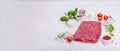 Dry aged Bavette steak with traditional spices and herbs. Fresh raw meat cut, light stone background Royalty Free Stock Photo