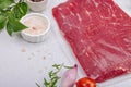 Dry aged Bavette steak with traditional spices and herbs. Fresh raw meat cut, light stone background Royalty Free Stock Photo