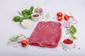 Dry aged Bavette steak with traditional spices and herbs. Fresh raw meat cut, light stone background Royalty Free Stock Photo