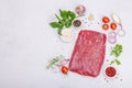 Dry aged Bavette steak with traditional spices and herbs. Fresh raw meat cut, light stone background Royalty Free Stock Photo