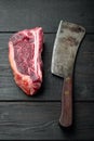 Dry-Aged ÃÂ¡lub raw steak prepared for cooking, on black wooden table background