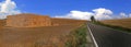 Dry agriculture land in contrast to a distant storm cloud during a heatwave in central Europe in jully 2018