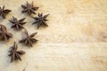 Dry anise stars aside on wooden cutting board