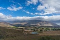 Dry arid countryside landscape with mountains and dam Royalty Free Stock Photo