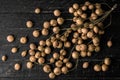 Dry Baccaurea ramiflora on wood table background