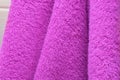 Dry bath towels are purple in the bathroom Royalty Free Stock Photo