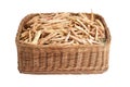 Dry bean pods in a wicker basket on a white background, isolate, close-up Royalty Free Stock Photo