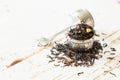 Dry black tea in infuser Royalty Free Stock Photo