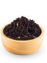 Dry Black Tea Leaves in wood cup with white background. Royalty Free Stock Photo