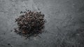 Dry black tea. On a rustic background. Royalty Free Stock Photo