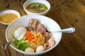 Dry boiled rice with braised pork rip, pork meatball, boiled egg and soup, sauce favorite delicious Asian food
