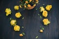 Dry bouquet of yellow roses on a black wooden background, copy space for text Royalty Free Stock Photo