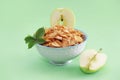 Dry Breakfast muesli and a natural green apple Royalty Free Stock Photo