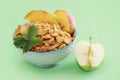 Dry Breakfast muesli and a natural green apple Royalty Free Stock Photo