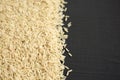 Dry Brown Rice background, side view. Copy space Royalty Free Stock Photo