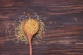 Dry bulgur grain in a wooden spoon. Royalty Free Stock Photo