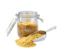 Bulgur in metal scoop and  in glass storage jar isolated on white background Royalty Free Stock Photo