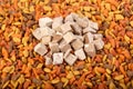 dry cat dog food in granules. Pile heap of pet treats, dried chicken liver, view from top above