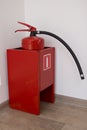 Dry chemical powder fire extinguisher in corridor Royalty Free Stock Photo