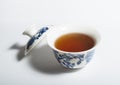 Dry Chinese oolong tea leaf and oolong tea in traditional cup on white, gaiwan tea Royalty Free Stock Photo