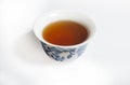 Dry Chinese oolong tea leaf and oolong tea in traditional cup on white, gaiwan tea Royalty Free Stock Photo