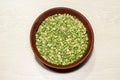 Dry chopped green peas in a bowl isolated Royalty Free Stock Photo